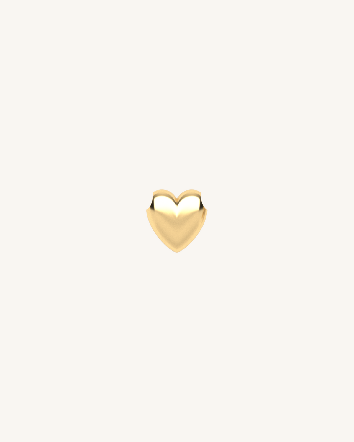 Puffed heart charm pendant in gold tone with raised edges