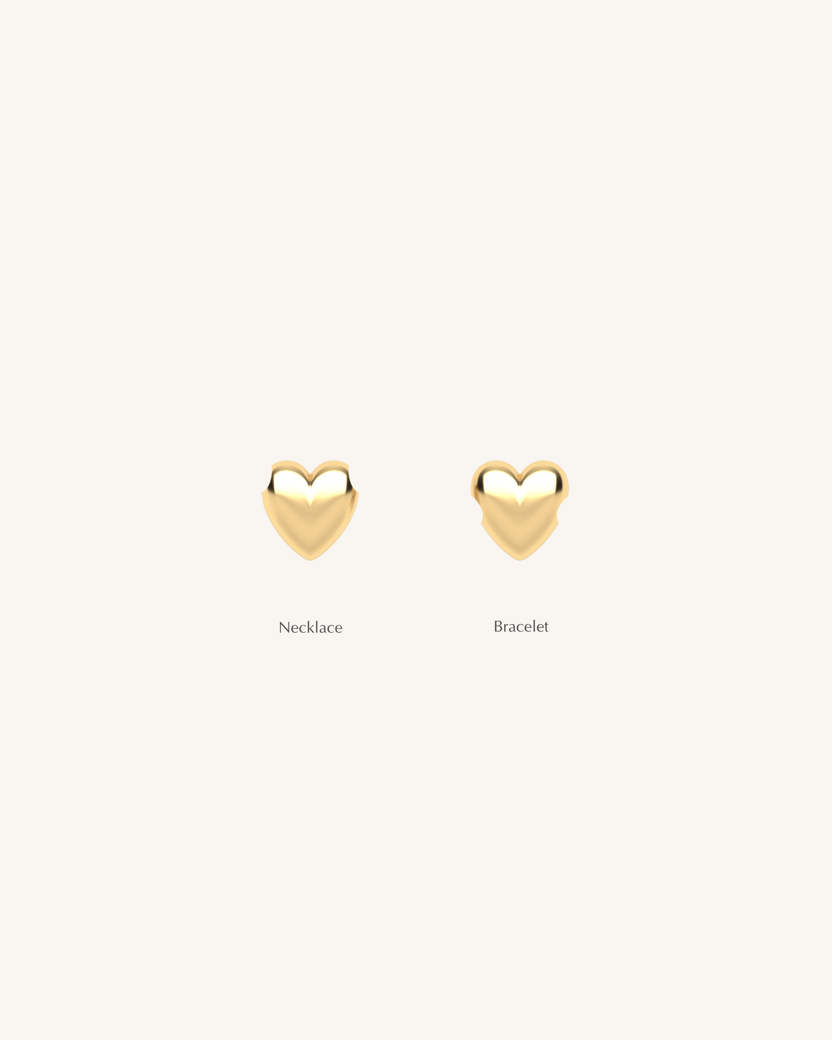 Two puffed heart charms in gold tone, one for necklace and one for bracelet
