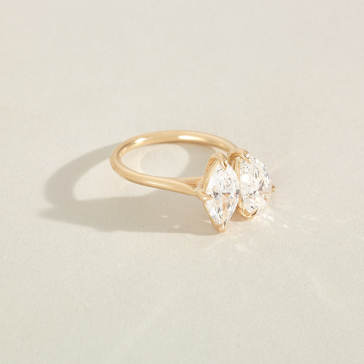 Pear and marquise lab-grown diamond ring with yellow gold band, front view