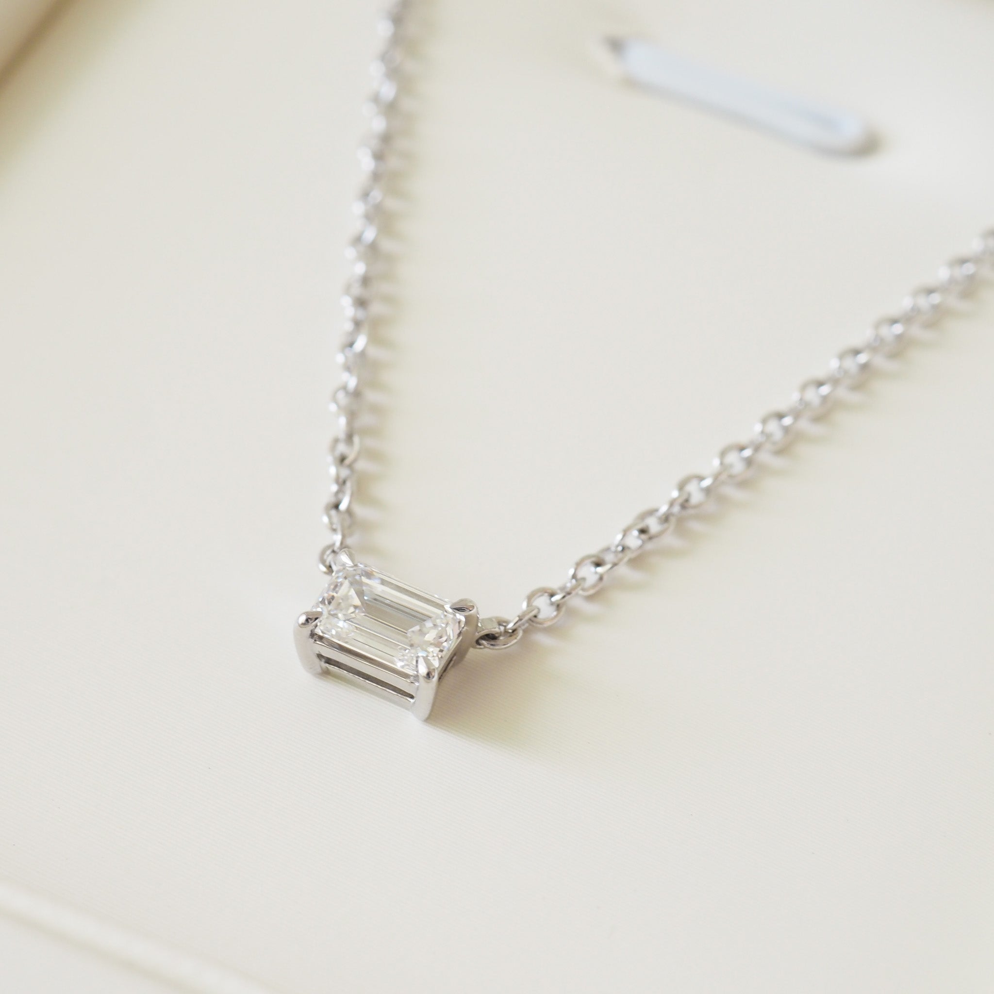 East-west emerald diamond necklace on white gold cable chain