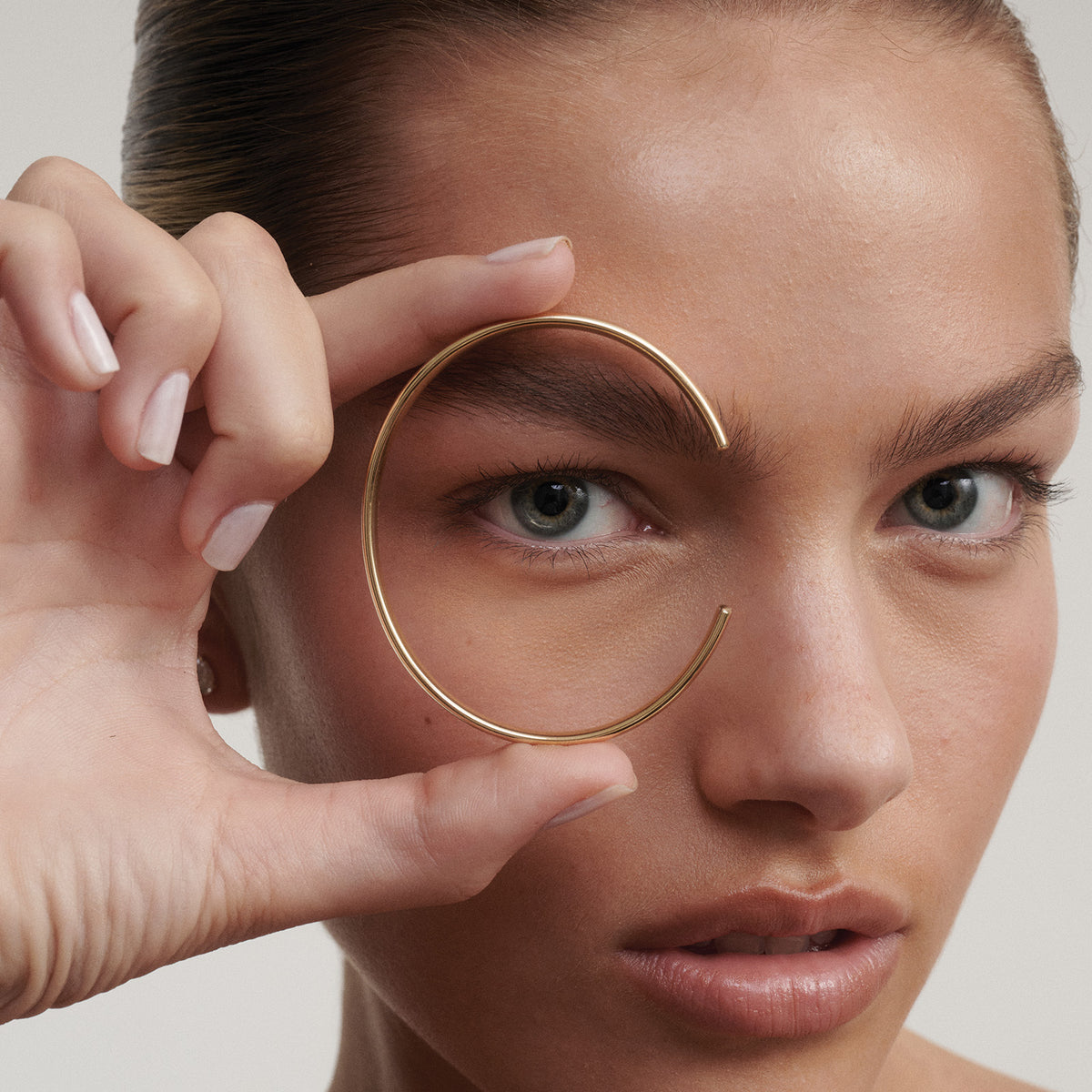 [text overlay: Side profile of our Extra Small (60mm) Cuff in 9ct Yellow Gold]