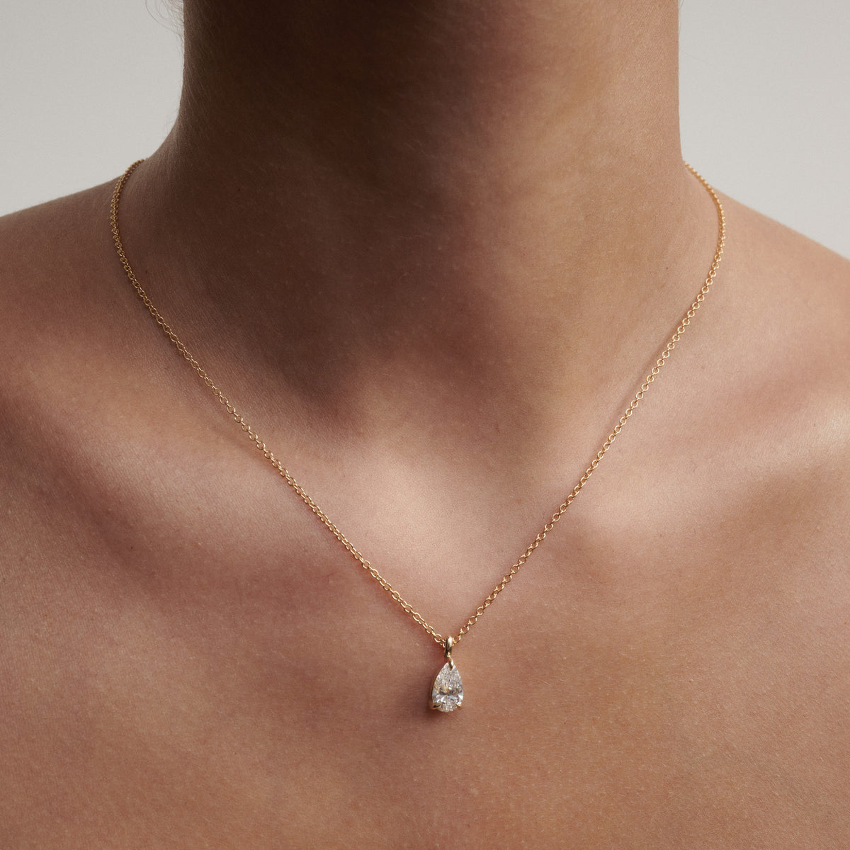 Pear lab-grown diamond pendant necklace with yellow gold chain and teardrop setting