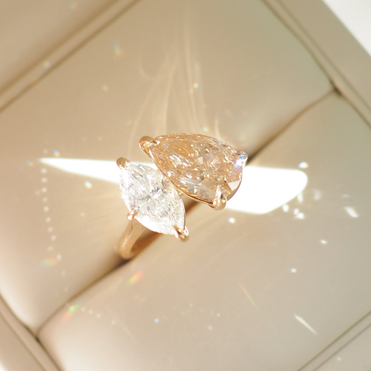 Champagne pear and marquise diamond toi et moi ring on gold-tone band