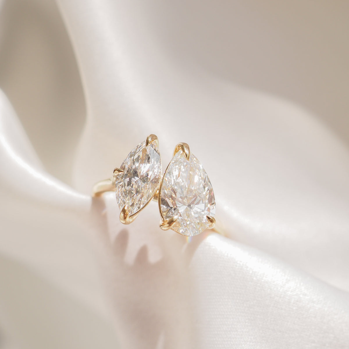 Pear and marquise lab-grown diamond engagement ring, yellow gold setting
