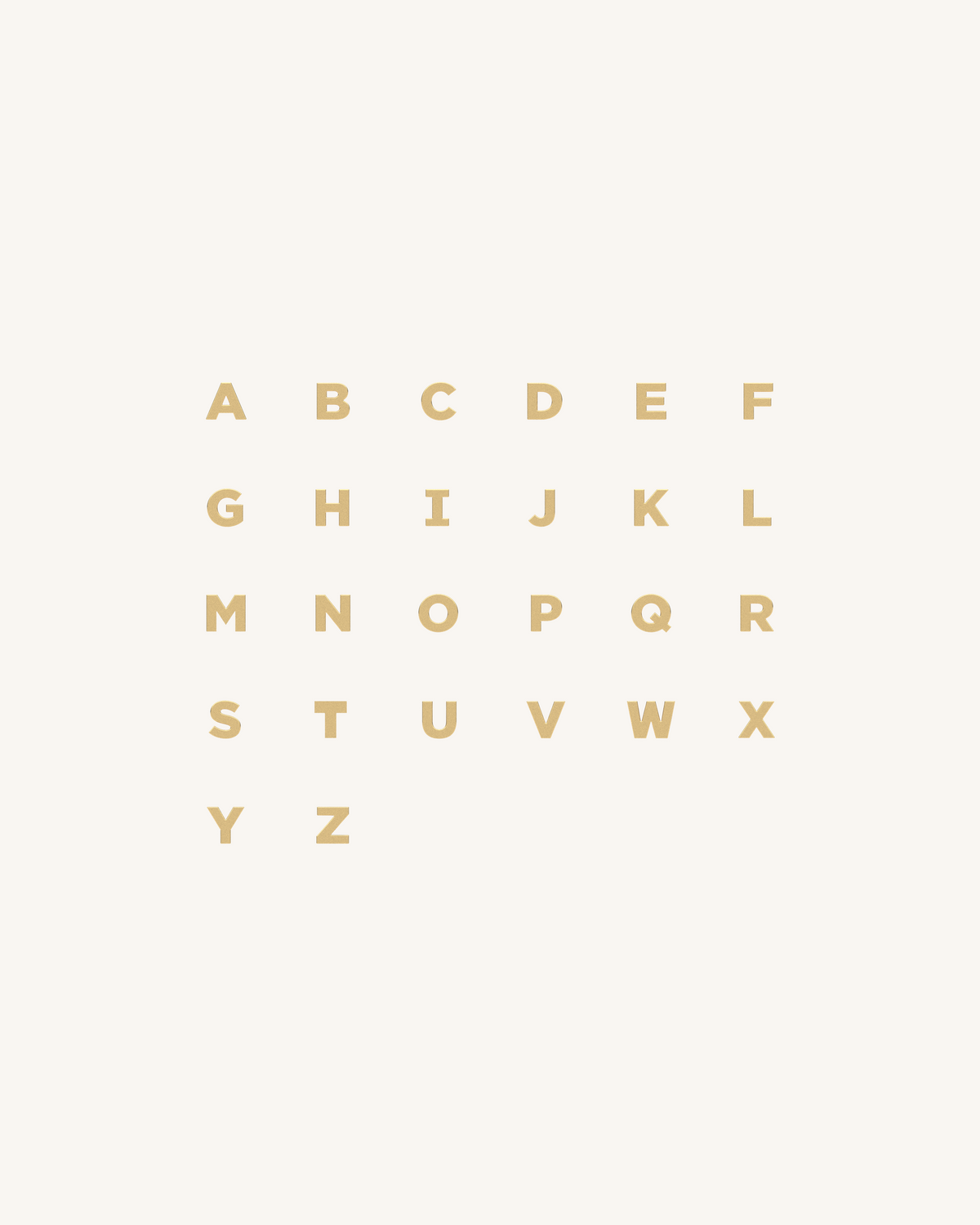 Gold alphabet letters on a white background