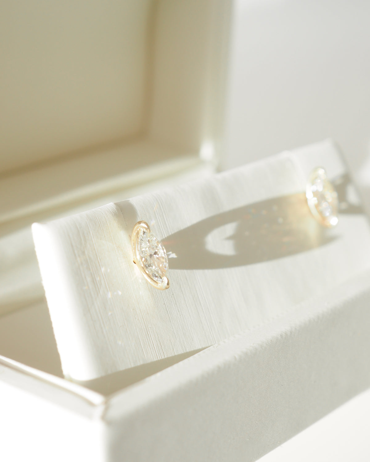 Marquise diamond stud earrings in 9ct yellow gold, in open gift box