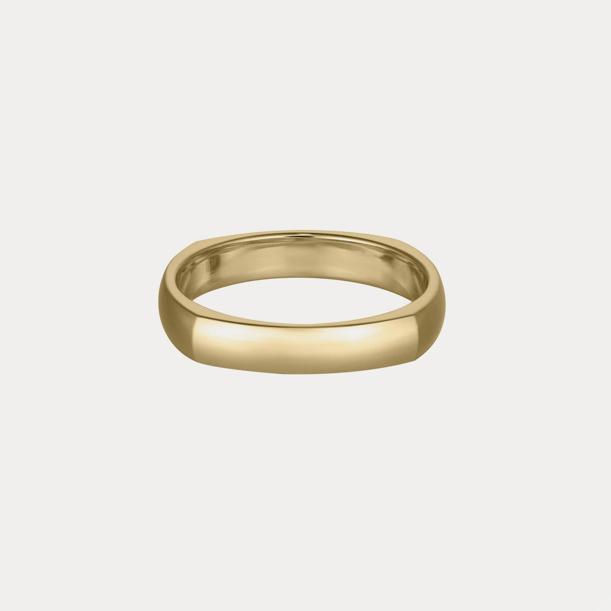Gold polished domed ring with a smooth, rounded surface on a plain white background, symbolising luxury and elegance in fine jewellery.