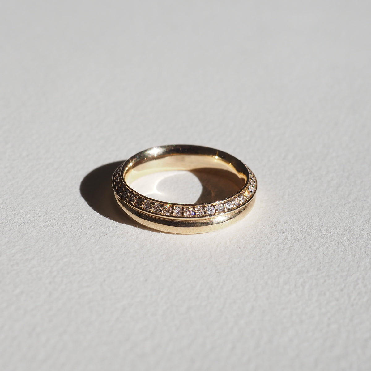Yellow gold diamond wedding ring with pavé-set stones