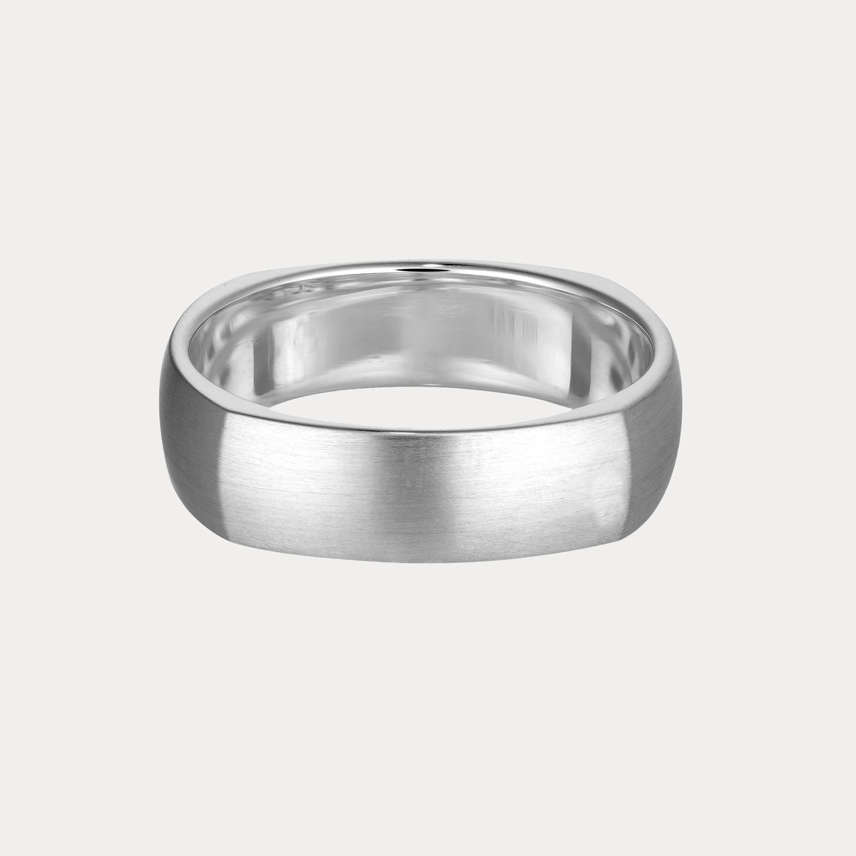 Sleek silver men's ring with a brushed finish on a light grey background, exemplifying luxury jewellery craftsmanship.
